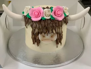 Corina Bakery - custom highland cows cake